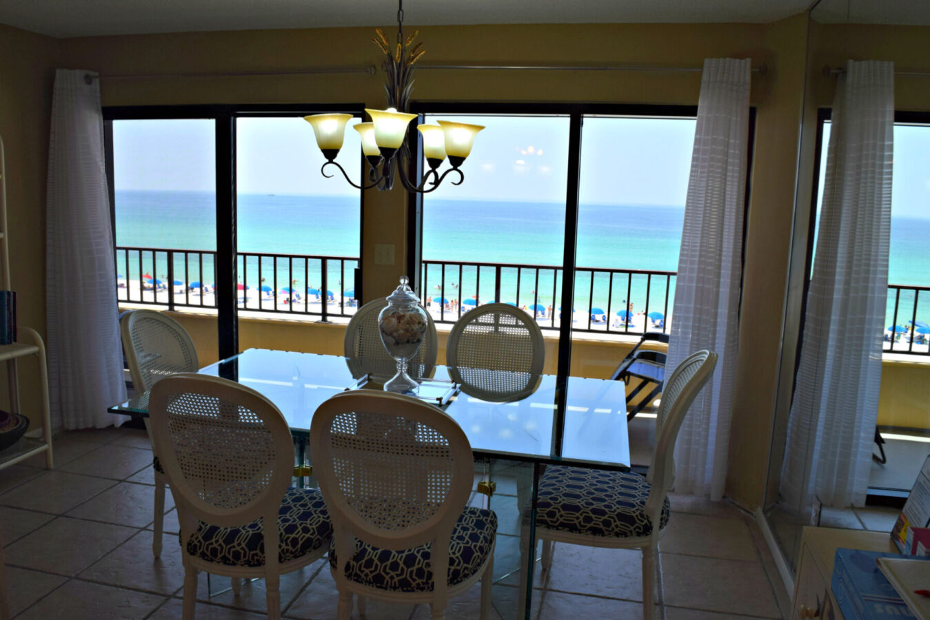 interior of vacation rental, highlighting a dining room with ocean view